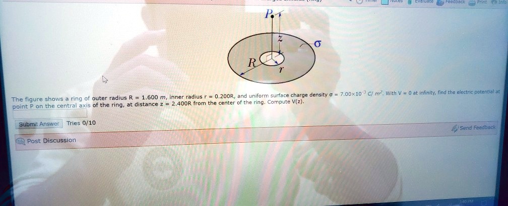 The figure shows a ring of outer radius R = 1.600 m, inner radius r = 0 ...