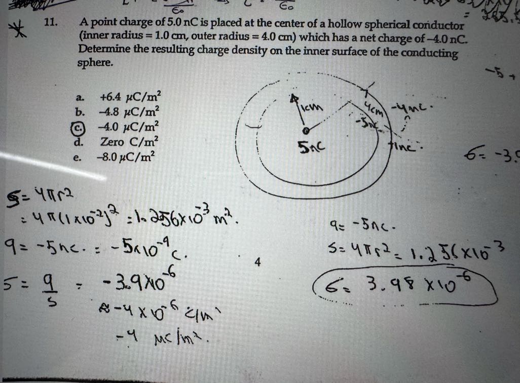 11. A point charge of 5.0 nC is placed at the center of a hollow ...
