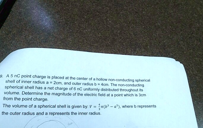 9. A 5 nC point charge is placed at the center of a hollow non ...